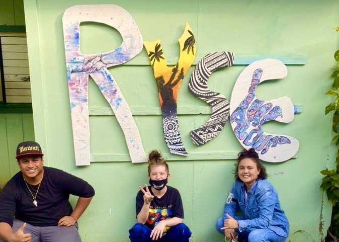 ryse sign w 3 kids kneeling